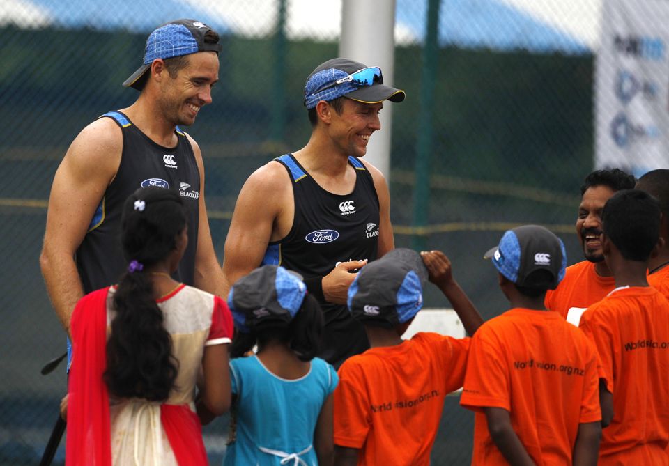 With a bunch of children in Visakhapatnam in 2016. "We hope that kids want to pick up a ball one day and want to bowl fast, move the ball in the air, swing the ball," Boult says