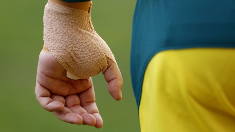 Travis Head's wrist was cocooned in bandage while he was on the field