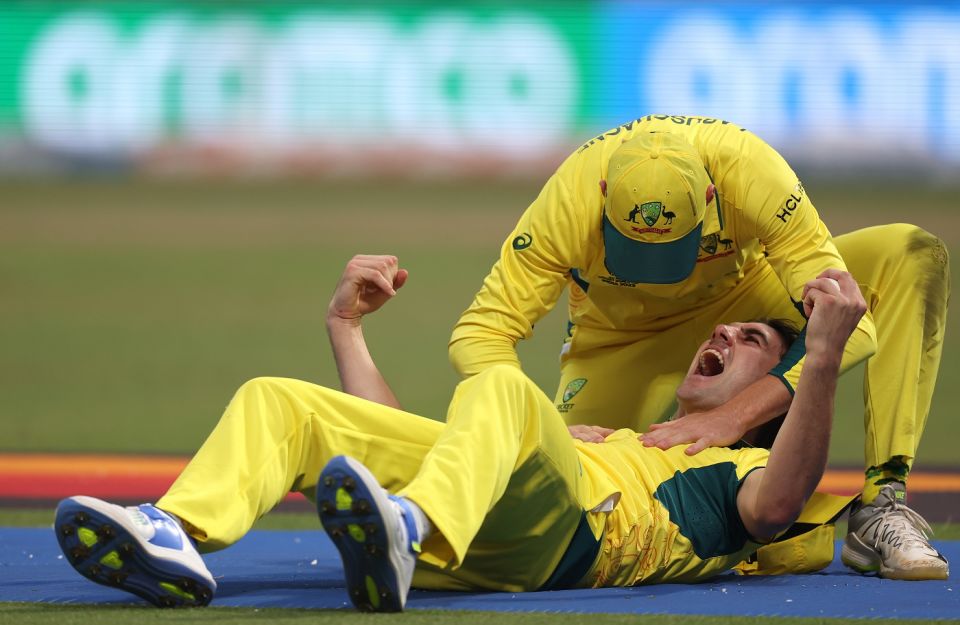 Pat Cummins exults after a quite stunning take to remove Quinton de Kock