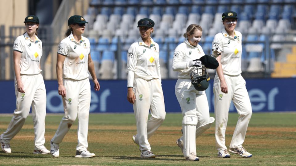 Alyssa Healy leads her team off after Australia's loss