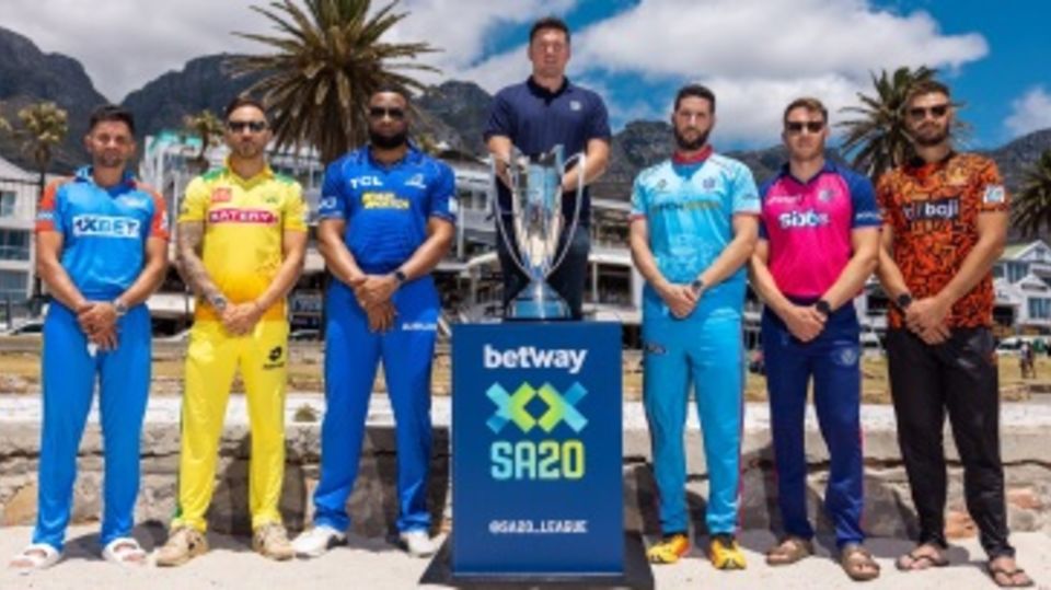 The six SA20 team captains and league commissioner Graeme Smith pose with the trophy