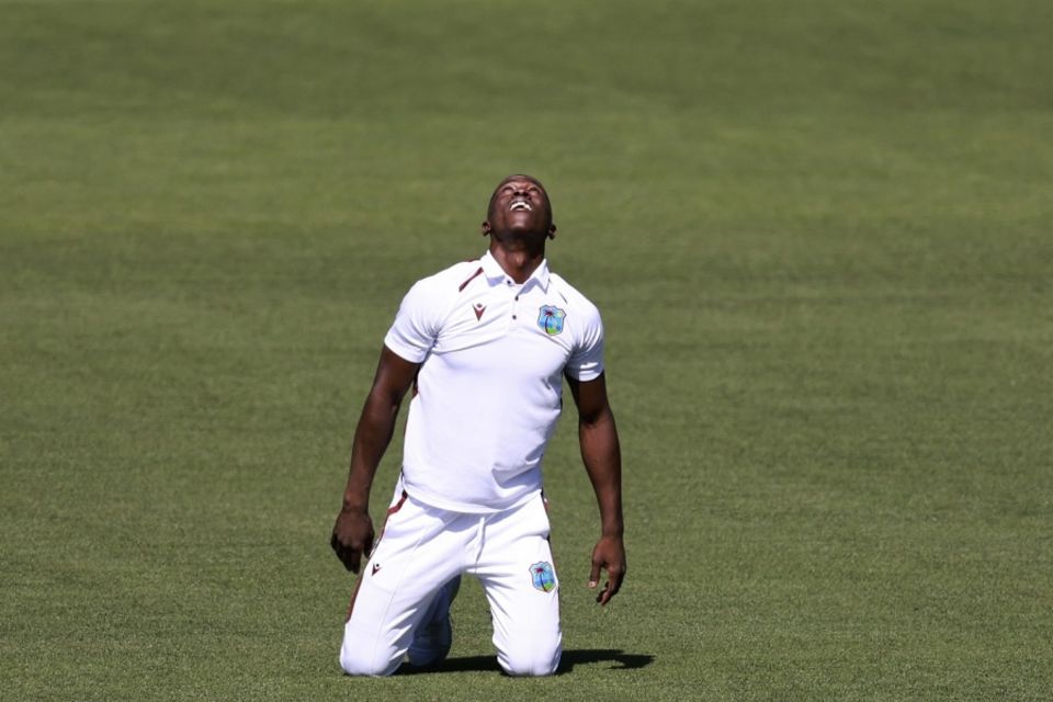 Shamar Joseph celebrates after dismissing Steven Smith with his first ball in Test cricket