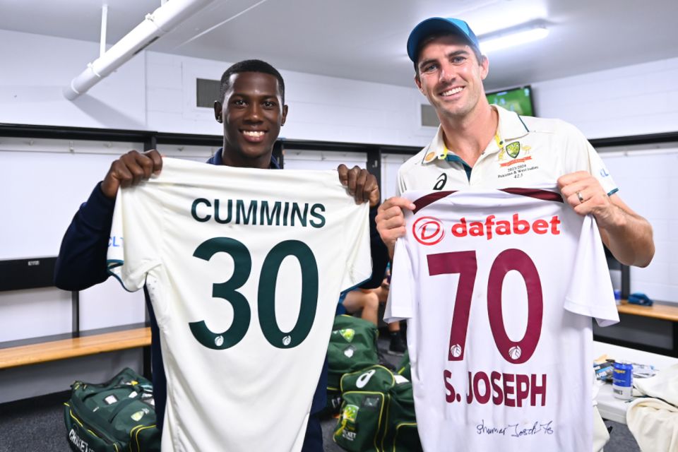 Pat Cummins and Shamar Joseph pose with their exchanged jerseys