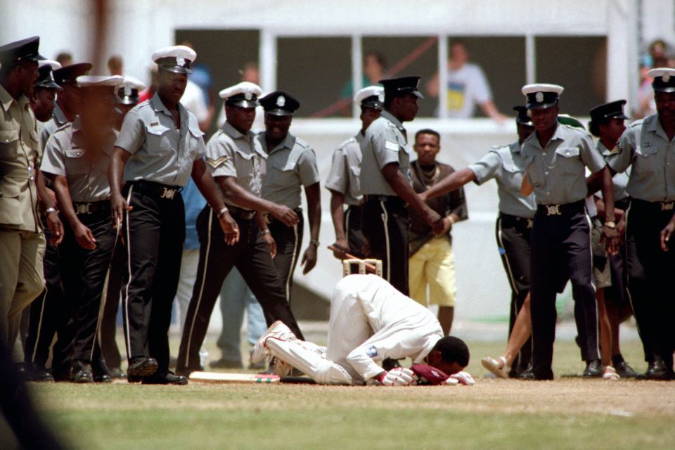 Another one bites the dust: the St John's pitch gets a peck from Lara after his mammoth 375