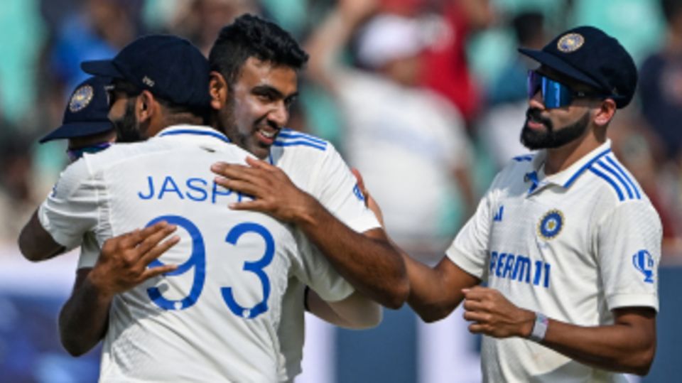 Jasprit Bumrah hugs R Ashwin after his 500th wicket