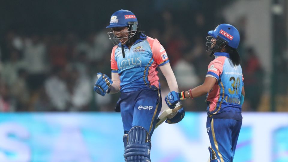 S Sajana roars in delight after slamming her first ball - the last of the innings - for six to take Mumbai Indians home