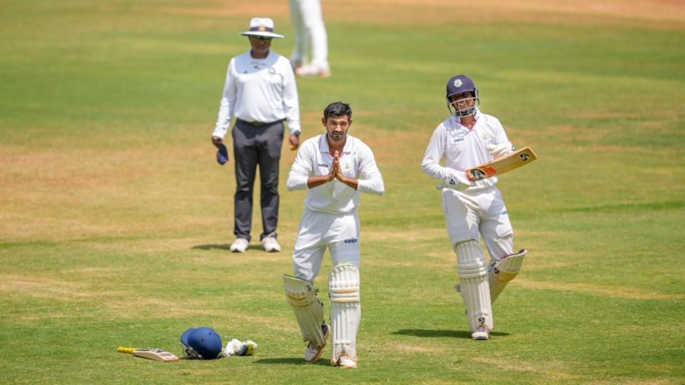 Akshay Wadkar celebrates his hundred as Harsh Dubey applauds