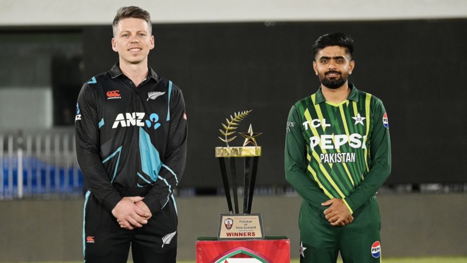 Michael Bracewell and Babar Azam with the T20I series trophy