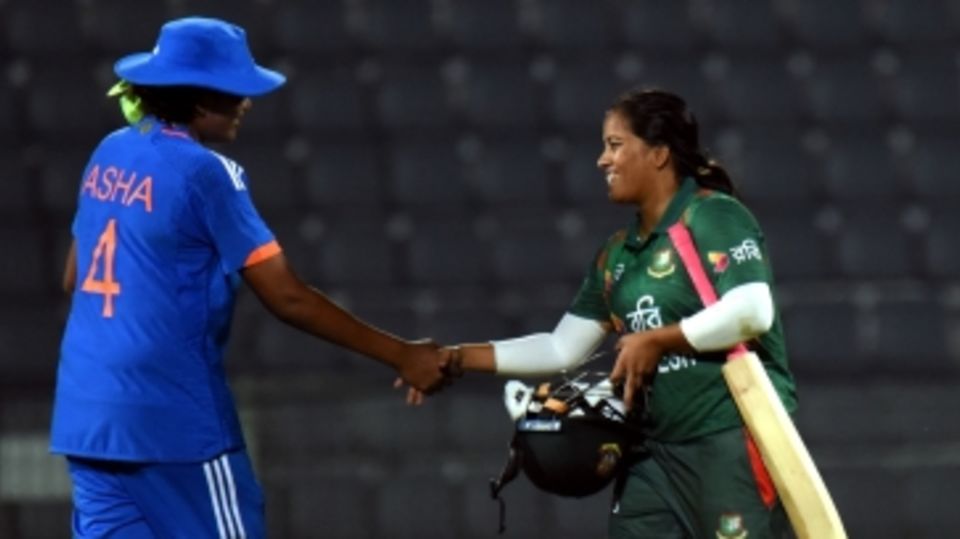 Debutant S Asha, who finished with 2 for 18, shakes hands with Nahida Akter