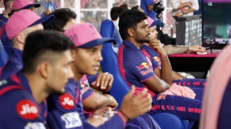 Sanju Samson watches the action from a subdued Royals dugout