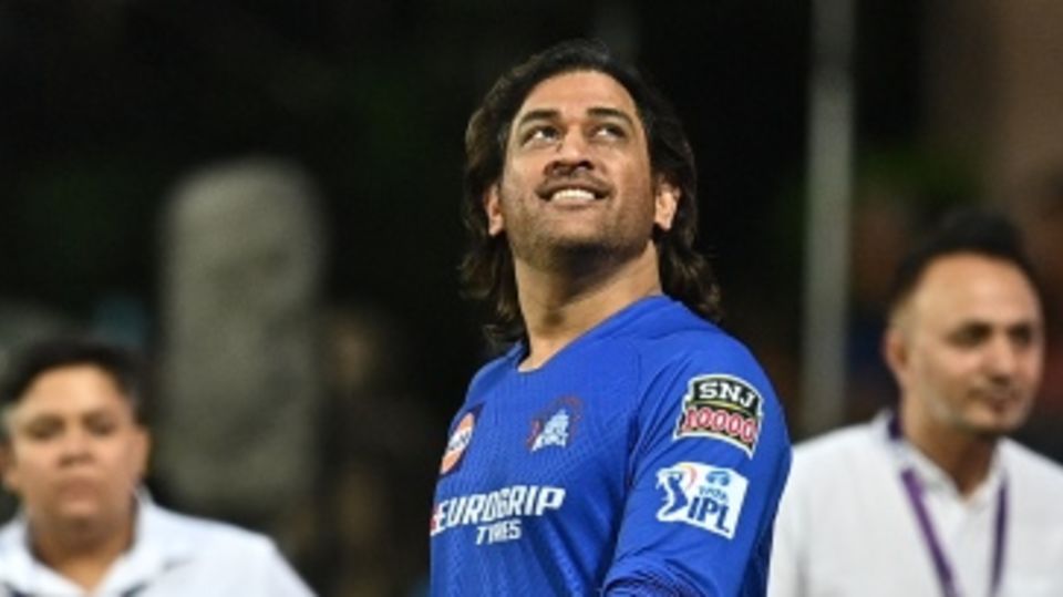 MS Dhoni walks out for a warm-up session