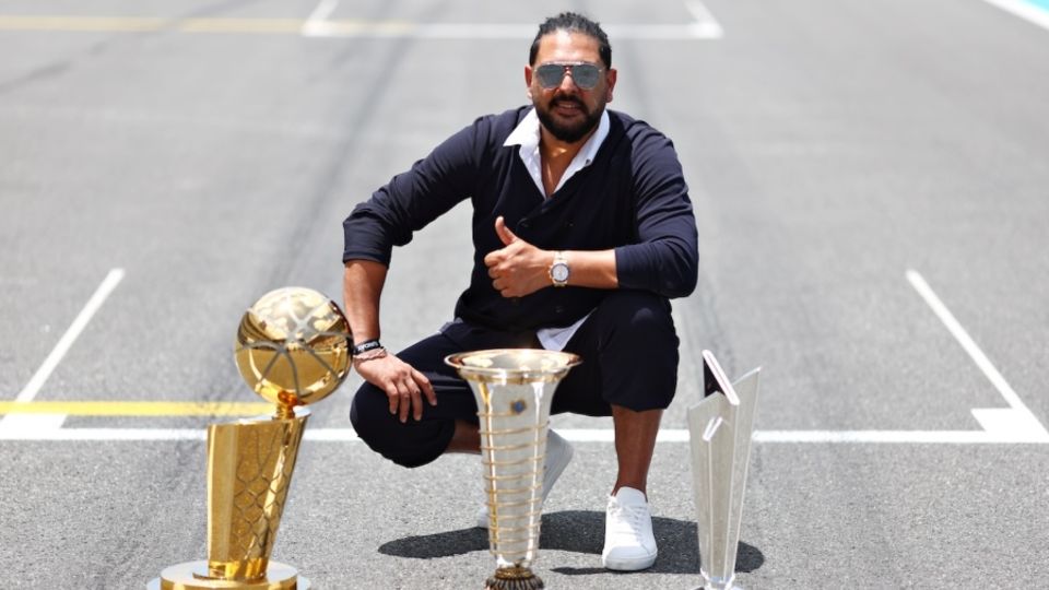 Yuvraj Singh is too cool for socks at an event at the Miami Grand Prix where they got him to pose with a bunch of sports trophies - among them the T20 World Cup one. Sweet synergy, Batman!