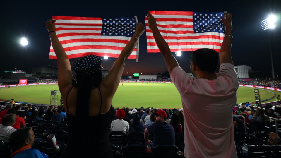 USA fans cheer their team with flags