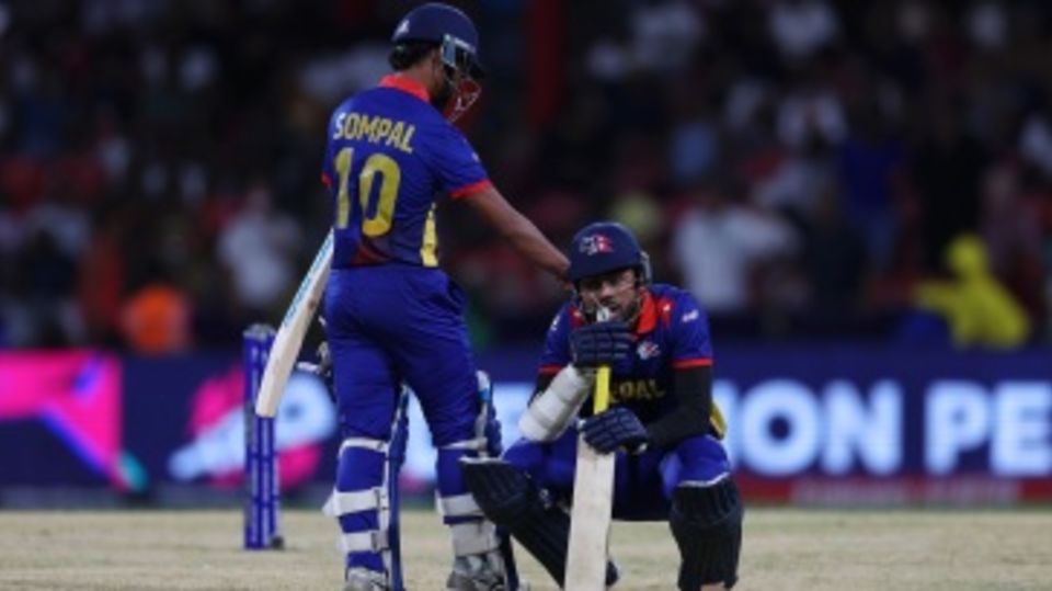 Gulsan Jha is consoled by Sompal Kami after Nepal came agonisingly close