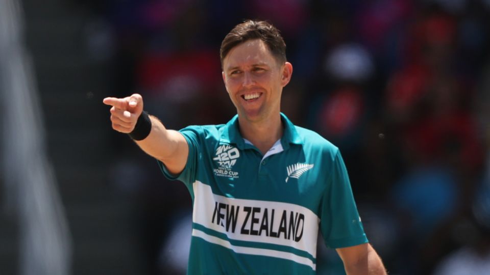 Trent Boult is all smiles as the batter attempts to take him on in his final World Cup match