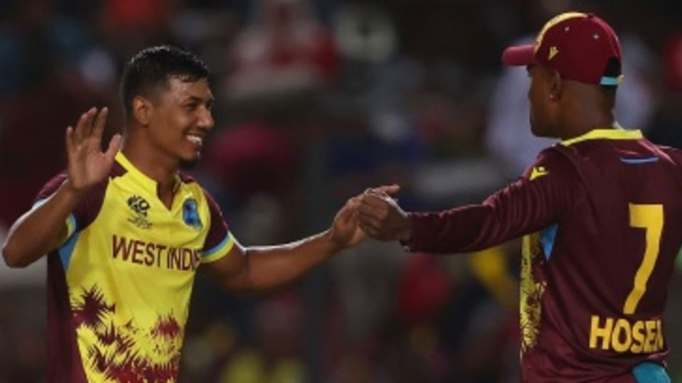 Gudakesh Motie and Akeal Hosein get together after the former dismissed Daryl Mitchell