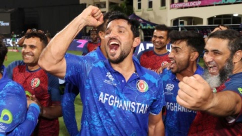 Gulbadin Naib celebrates with his team-mates