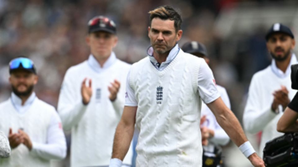 James Anderson leads his team-mates off