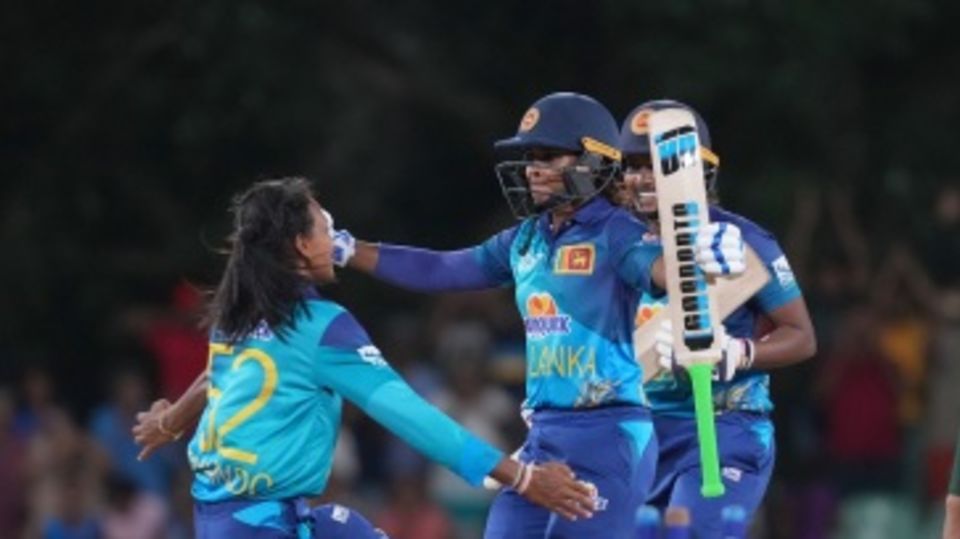 Team-mates rush to celebrate the win with Anushka Sanjeewani