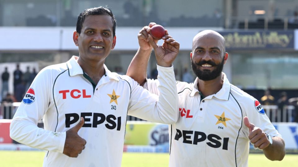 Noman Ali and Sajid Khan pose with the match ball after the third Test