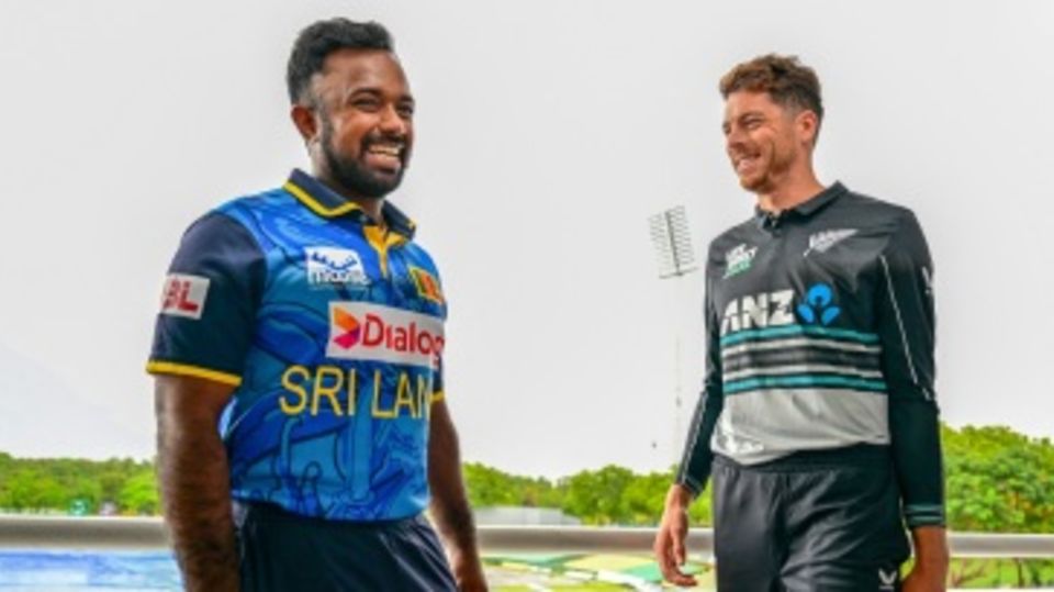 Charith Asalanka and Mitchell Santner share a light moment