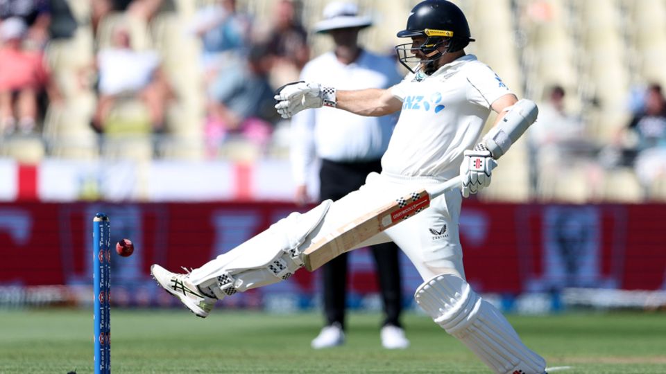 Kane Williamson tries - and fails - to prevent the ball bouncing back on to his stumps
