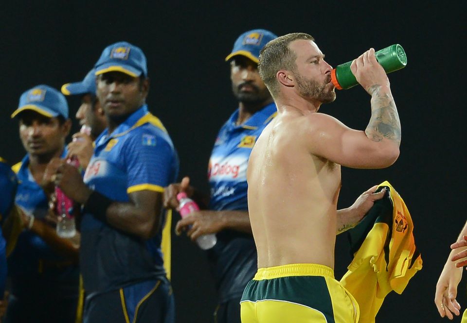 Water body: Sri Lanka players get an eyeful of a shirtless Matthew Wade in the drinks break
