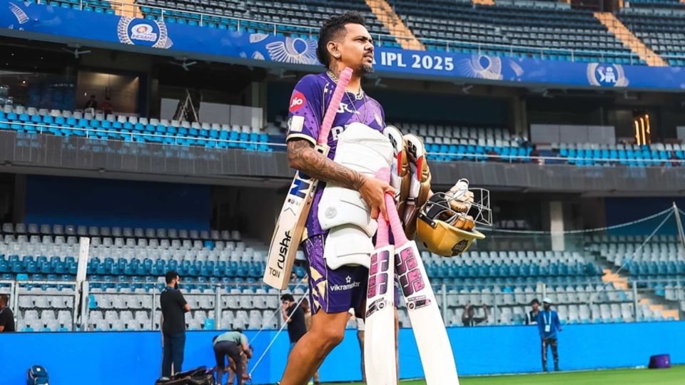 Sunil Narine walks in for a training session ahead of KKR's game against Mumbai Indians