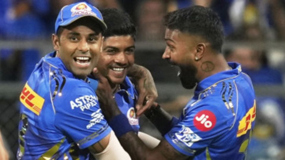 Ashwani Kumar is mobbed by Suryakumar Yadav and Hardik Pandya after his first-ball strike
