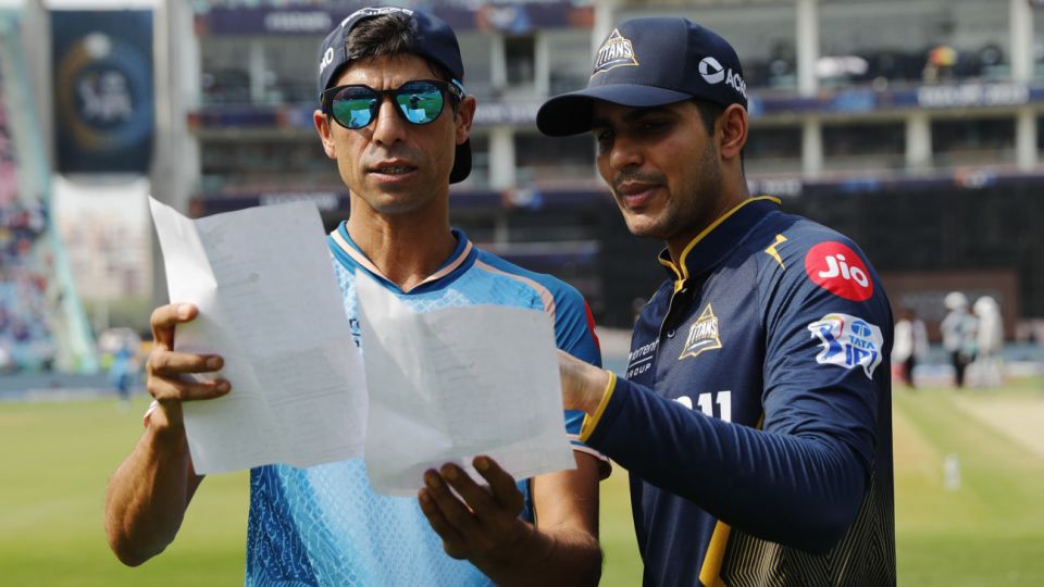 Shubman Gill goes through the team sheets with Ashish Nehra
