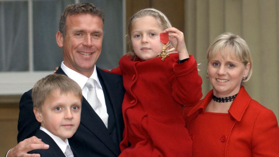 Lynn Stewart, right, with Alec and their children at Buckingham Palace in 2003