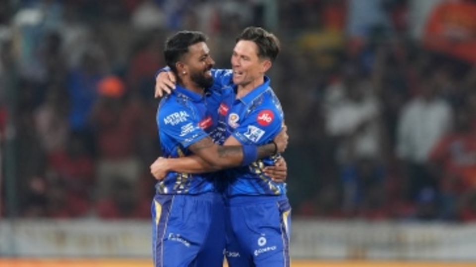 Trent Boult gets a hug from captain Hardik Pandya for getting Travis Head for a duck