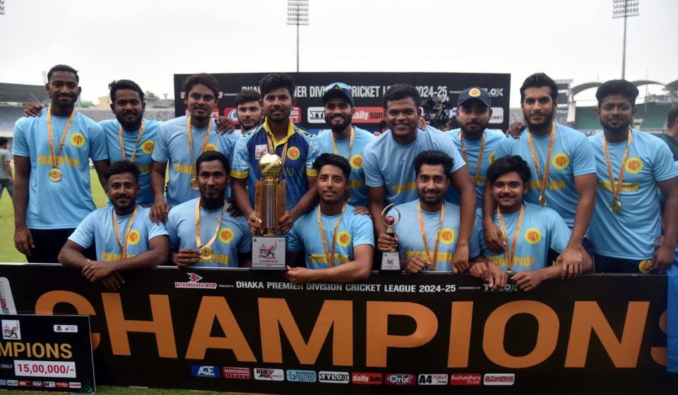 The Abahani Limited players pose with the trophy
