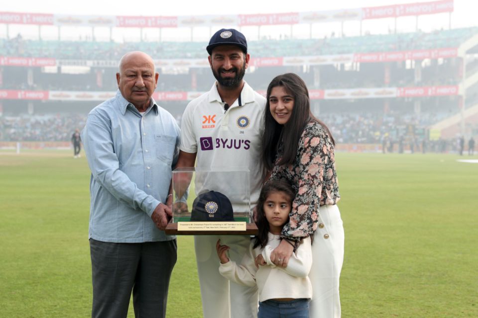 Puja's book is a glimpse into the life of the otherwise very private Cheteshwar Pujara, seen here with her and his father before his 100th Test, in 2023