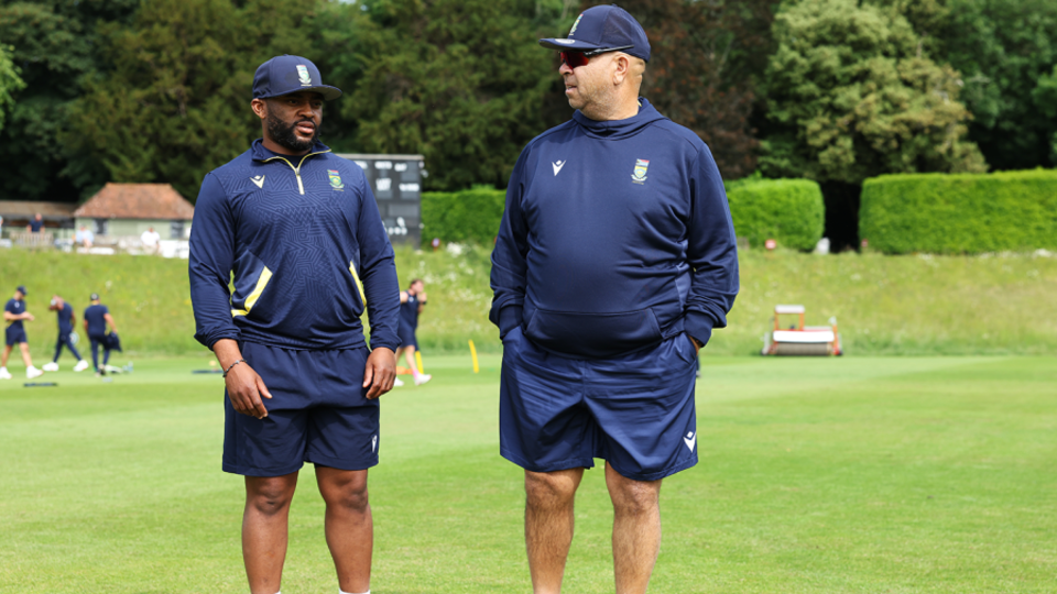 Temba Bavuma and coach Shukri Conrad chat