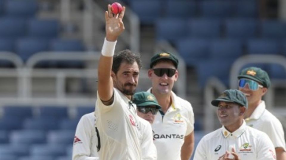 Mitchell Starc celebrates his 400th Test wicket