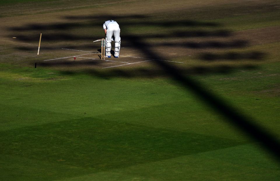 Shade on you: Will Rhodes loses his off stump in the dark