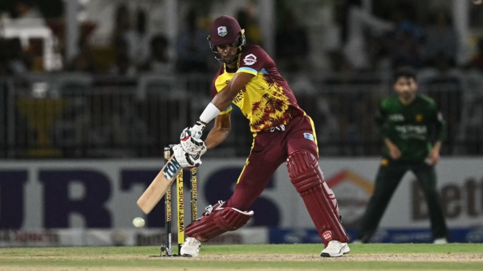 Roston Chase misses with a swing during his 12-ball 15