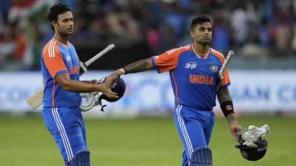 Shivam Dube and Suryakumar Yadav walk back after India's win