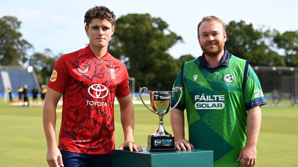Jacob Bethell and Paul Stirling pose with the series trophy at Malahide Cricket Club