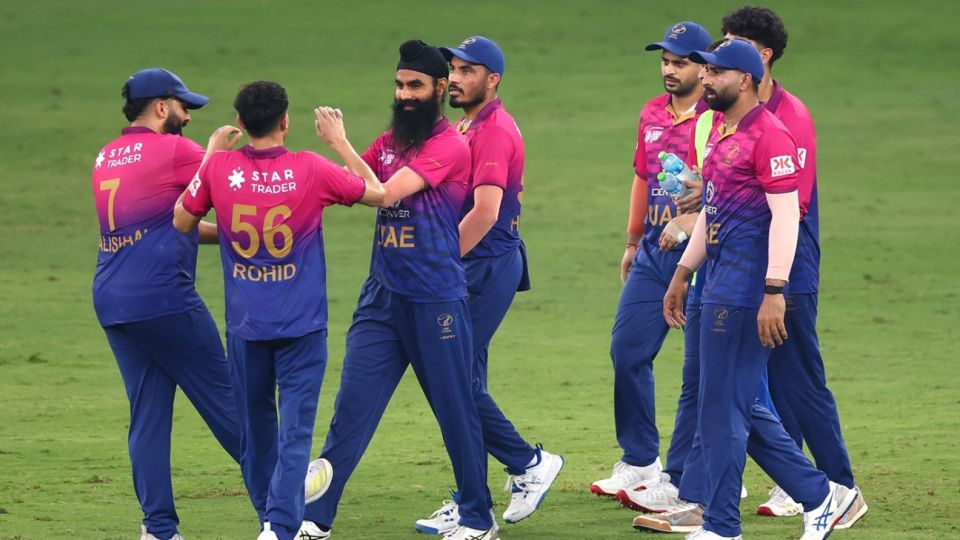 Simranjeet Singh celebrates a wicket with his team-mates