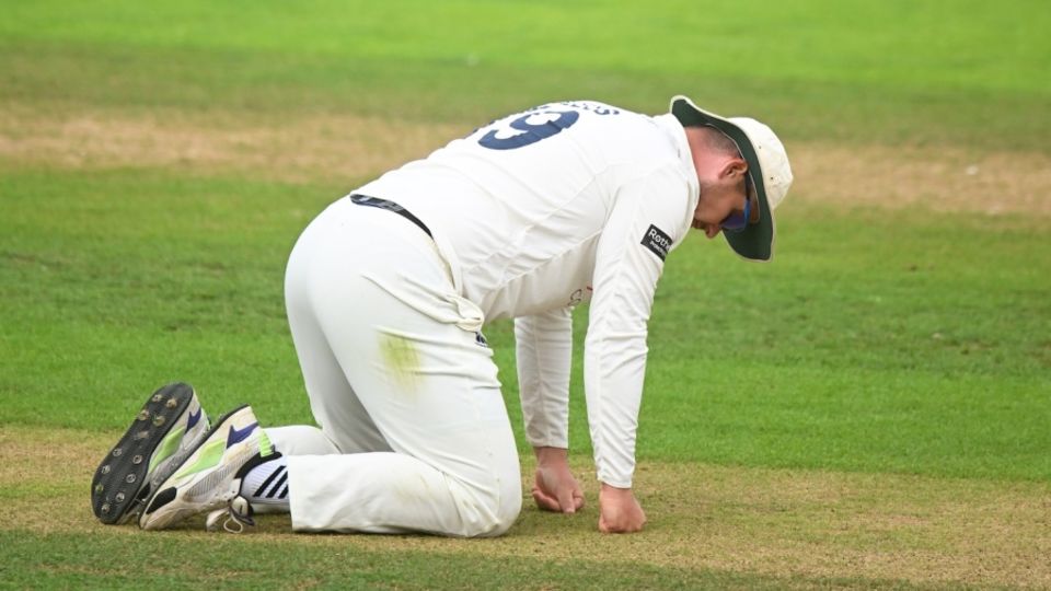 Durham captain Alex Lees assesses the Taunton pitch on day one