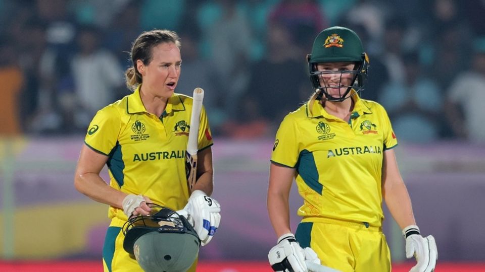 Ellyse Perry and Kim Garth walk off after Australia sealed the highest chase in women's ODI history