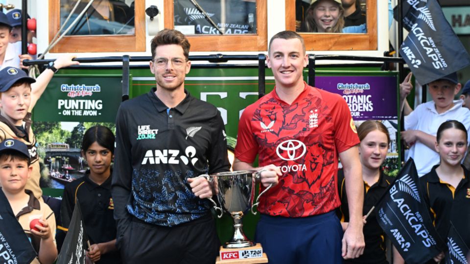 Mitchell Santner and Harry Brook pose with the series trophy in Christchurch