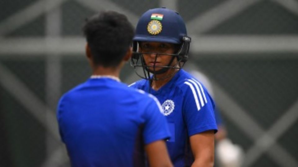 Harmanpreet Kaur looks on at the training