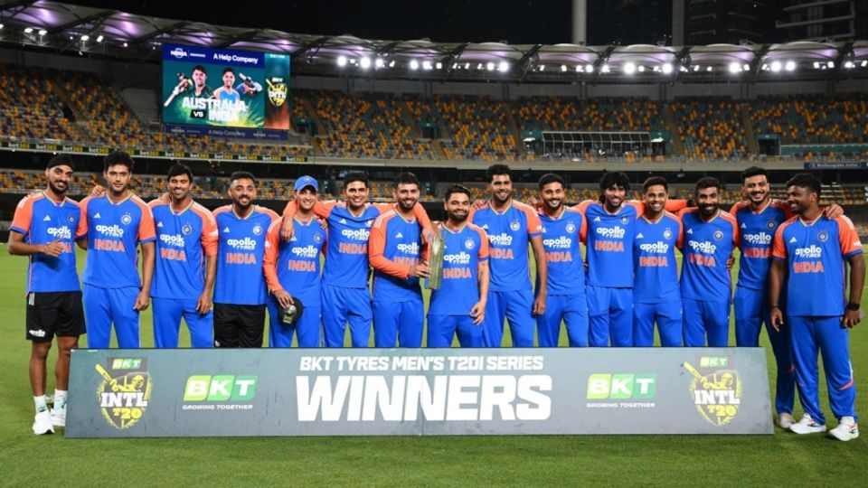 The India T20I squad with the series trophy in Brisbane