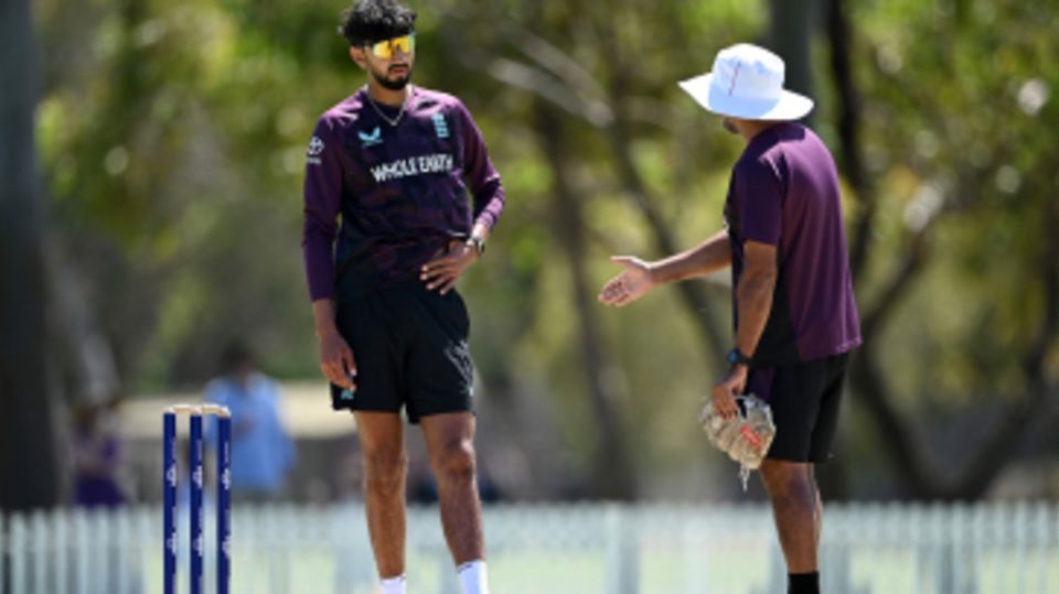 Shoaib Bashir in discussion with Jeetan Patel
