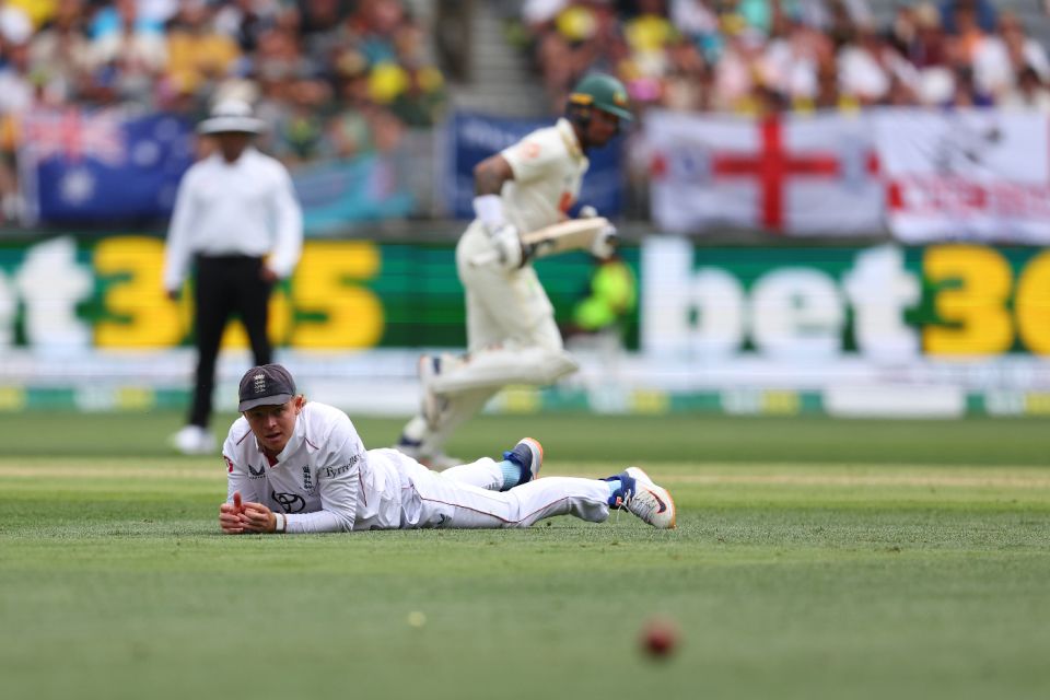 Ollie Pope looks on in vain as Australia pile on the runs