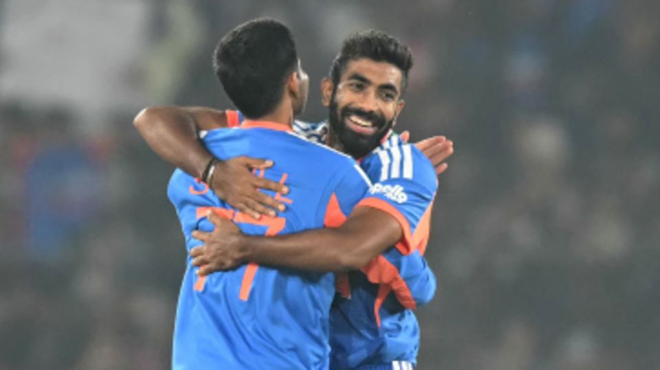 Jasprit Bumrah embraces his captain