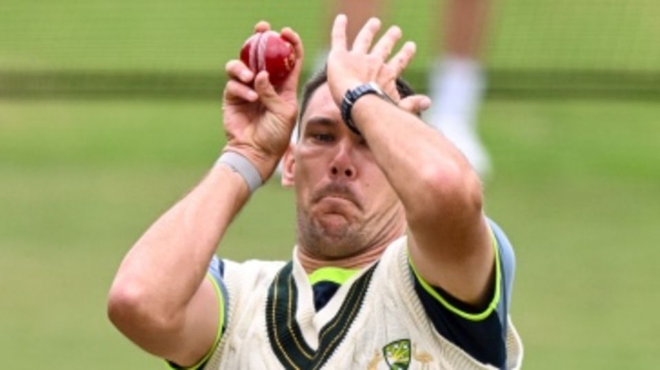 Scott Boland has a bowl at training